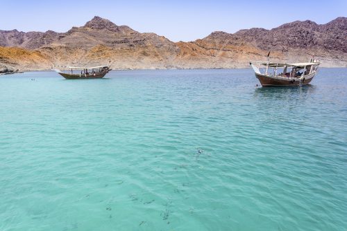 Traditional Arabic Dhows in the wild fjord of Musandam