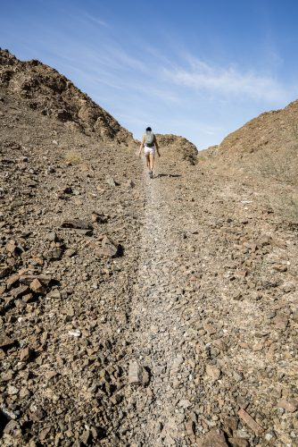 Woman trekking in a Wadi (Dry mountains) of Showka, RAK, UAE 🇦🇪