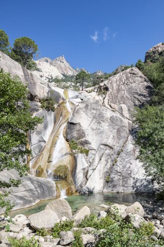 Waterfall and natural pool in the famous Purcaraccia Canyon in Bavella, Corsica