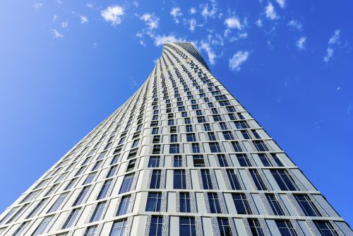 Cayan Tower, known as Infinity Tower prior to its inauguration, is a 306-metre-tall (1,004 ft), 73-story skyscraper in Dubai, United Arab Emirates by Cayan Real Estate Investment and Development. The tower is designed by Skidmore, Owings and Merrill SOM architectural group, the same group who did the concept design for the Burj Khalifa, also in Dubai, and Trump Tower in Chicago. Upon its opening on 10 June 2013, the tower became world's tallest high-rise building with a twist of 90 degrees.