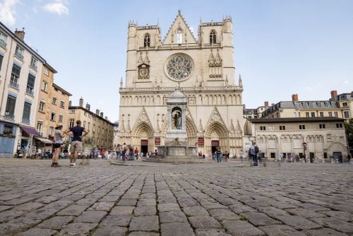 Cathedral Saint-Jean-Baptiste de Lyon with crowd, Roman Catholic church located on Place Saint-Jean in Lyon, France, Europe